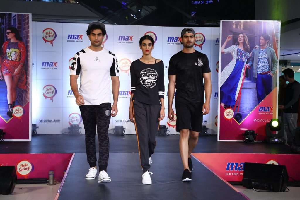 Model walking the ramp showcasing the garments around 4 themes which revolve around FUN, WORK, TRAVEL, PLAY. Here models are sporting the collection of PLAY Theme
