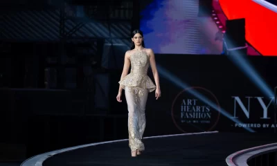 A model walking the runway at wuxi china fashion show published by Fashion Herald top runway magazine new york
