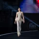 A model walking the runway at wuxi china fashion show published by Fashion Herald top runway magazine new york