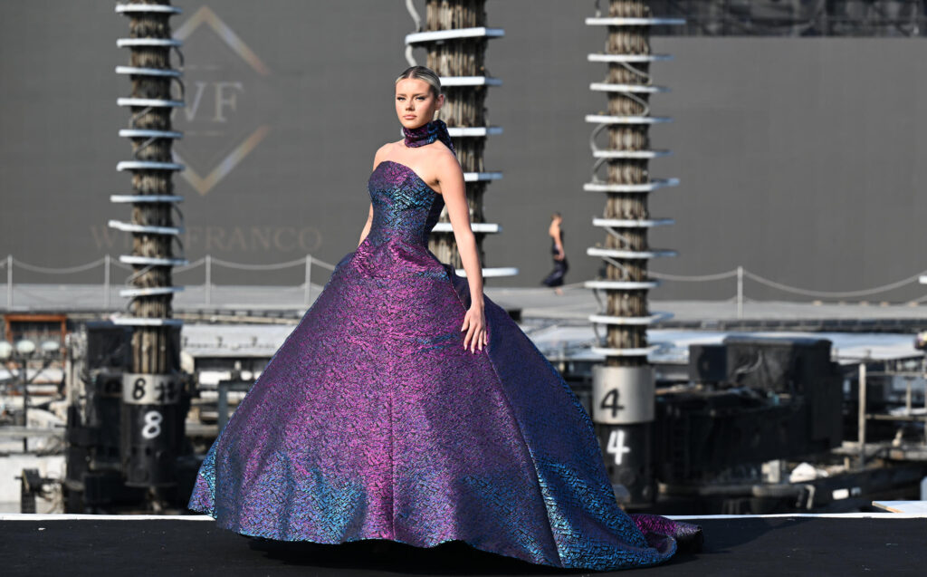 A model walking the runway at wuxi china fashion show published by Fashion Herald top runway magazine new york